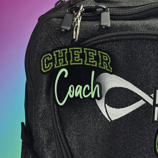 Black backpack with colorful designs and text on a gradient background