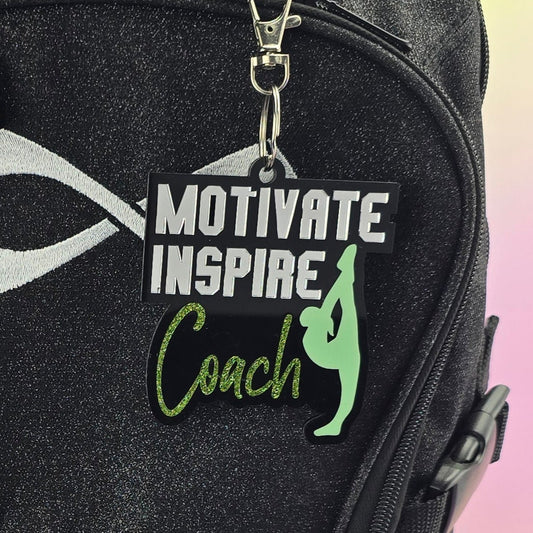 Black backpack with colorful designs and text on a gradient background